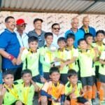 U-10 Football Winning Antonio Boys Holding Champion Trophy